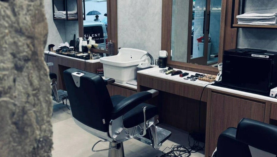 Silent Blue Barbershop interior with sleek barber chair in Hong Kong, HK, reflecting modern elegance.