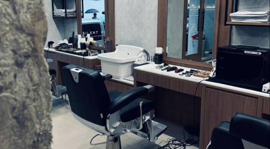 Silent Blue Barbershop interior with sleek barber chair in Hong Kong, HK, reflecting modern elegance.