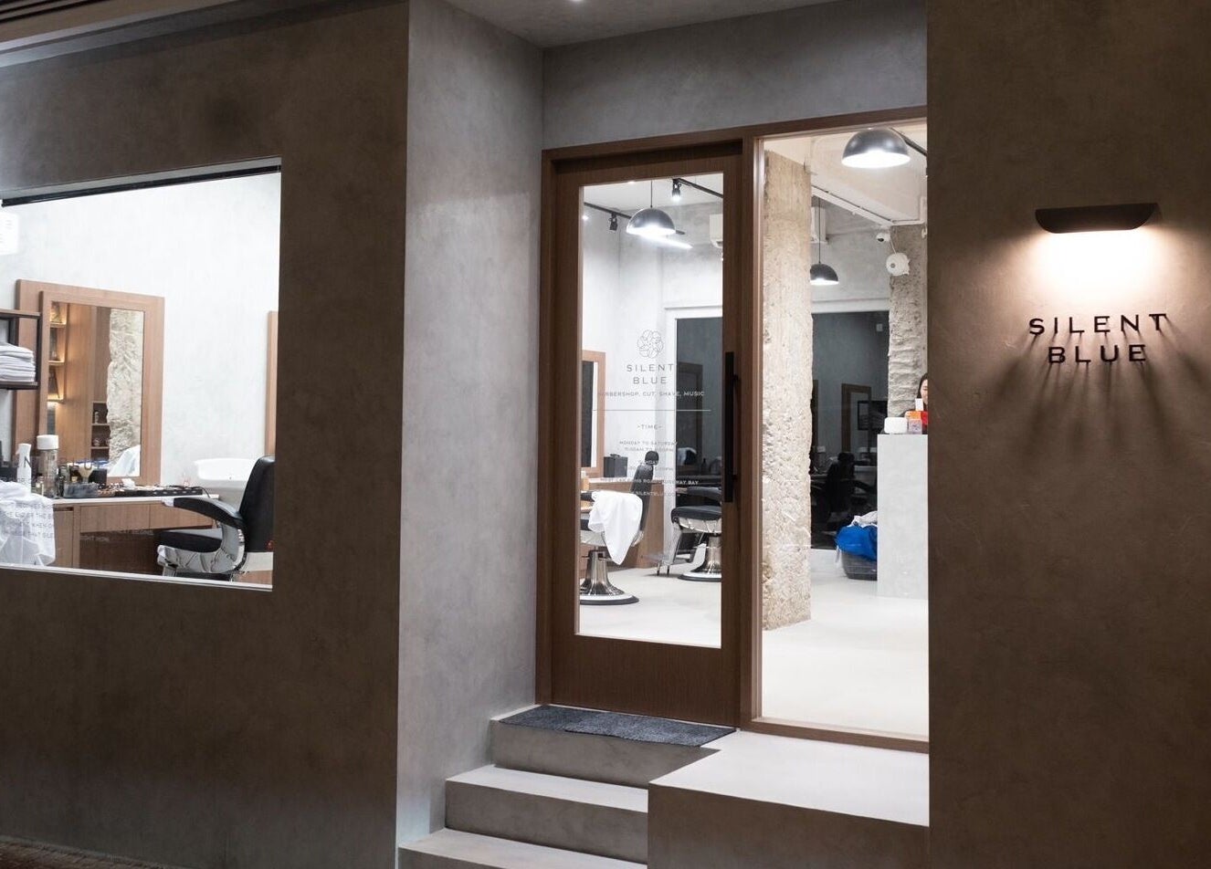 Silent Blue Barbershop entrance in Hong Kong, HK showcasing modern design and sleek interiors.