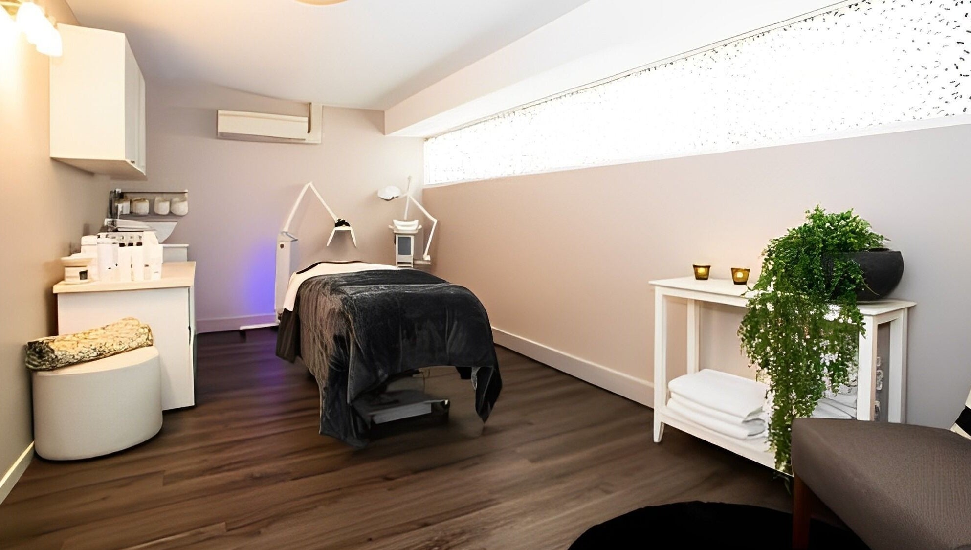 Tranquil treatment room at Nourish Spa and Skin Clinic in Melbourne, VIC, AU with elegant decor and warm lighting.