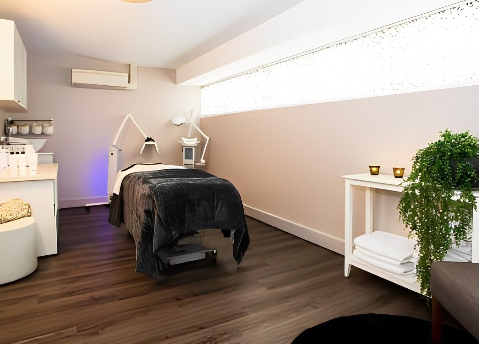 Tranquil treatment room at Nourish Spa and Skin Clinic in Melbourne, VIC, AU with elegant decor and warm lighting.