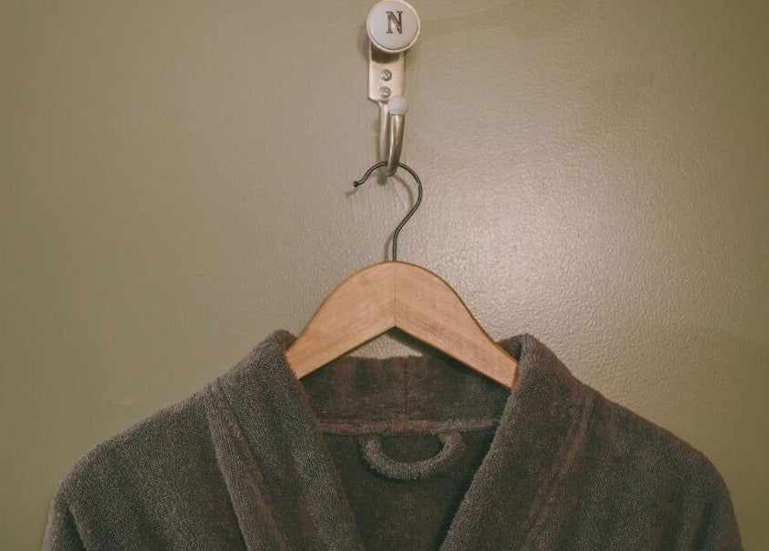 Luxurious robe on wooden hanger at Nourish Spa and Skin Clinic, Melbourne, VIC, AU.