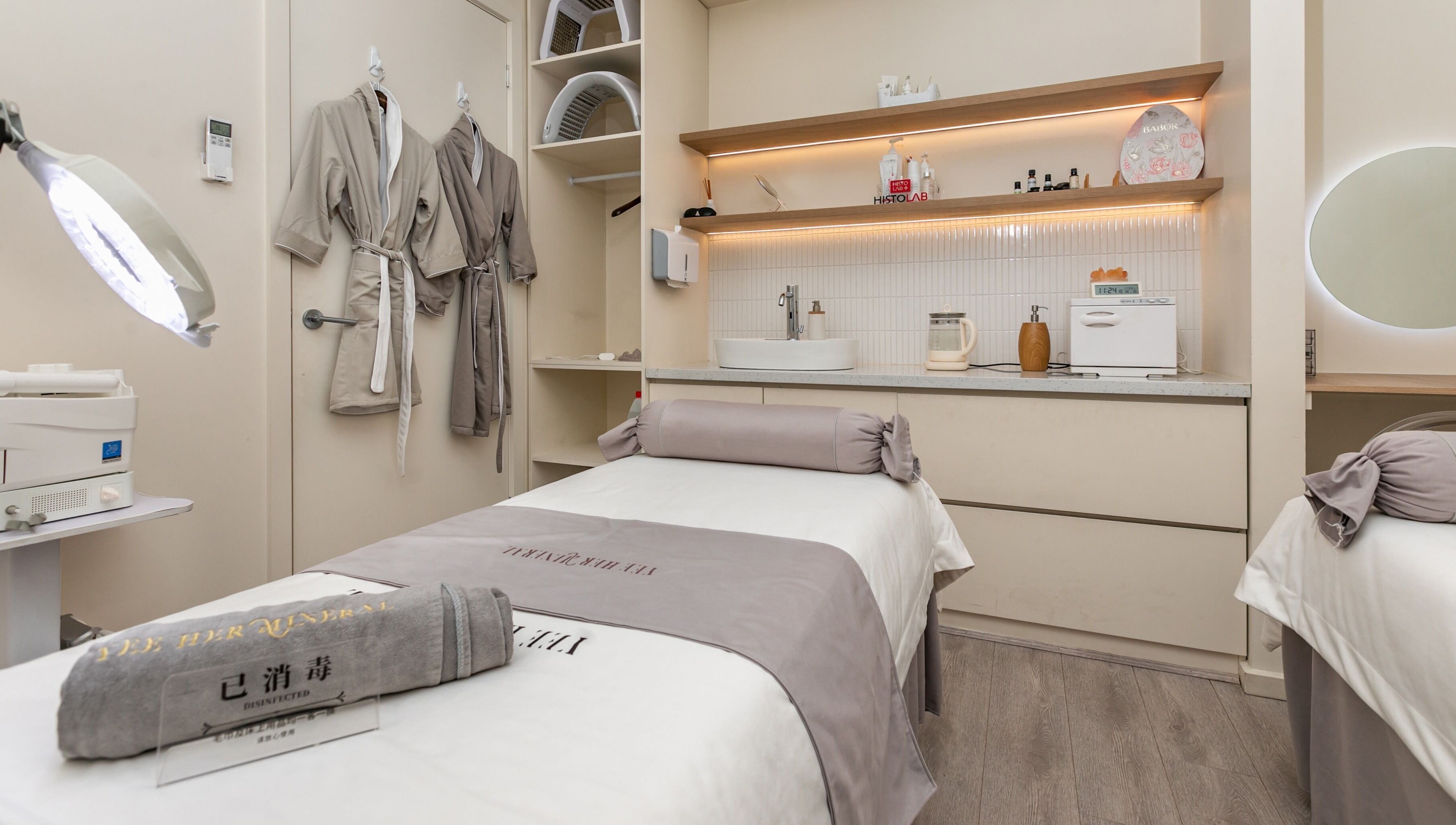 Serene treatment room at Yee Her Mineral, Melbourne, Victoria, AU, featuring plush robes and calming ambiance.