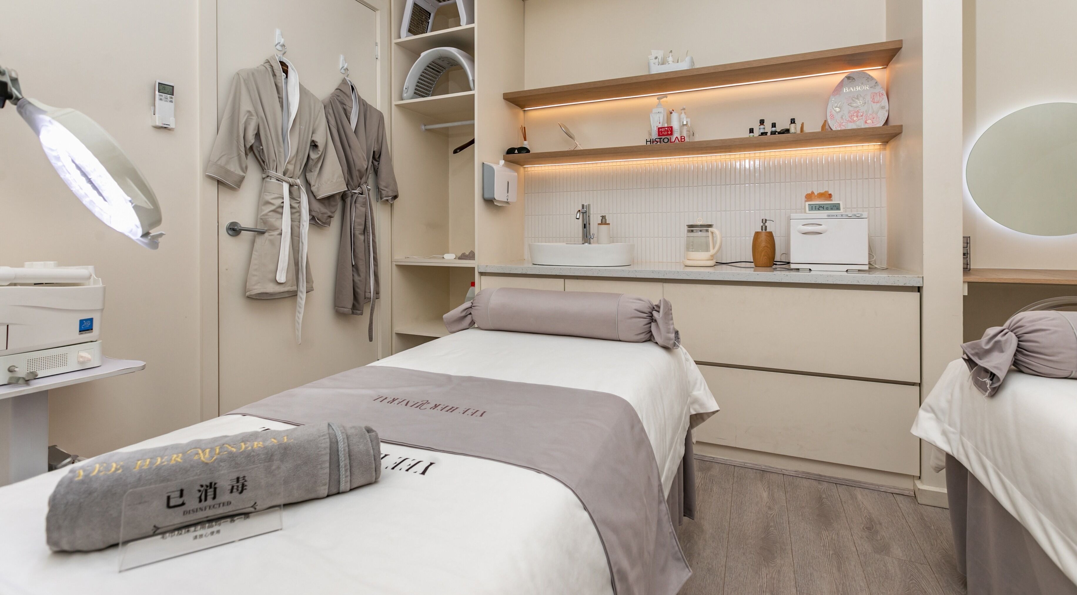 Serene treatment room at Yee Her Mineral, Melbourne, Victoria, AU, featuring plush robes and calming ambiance.