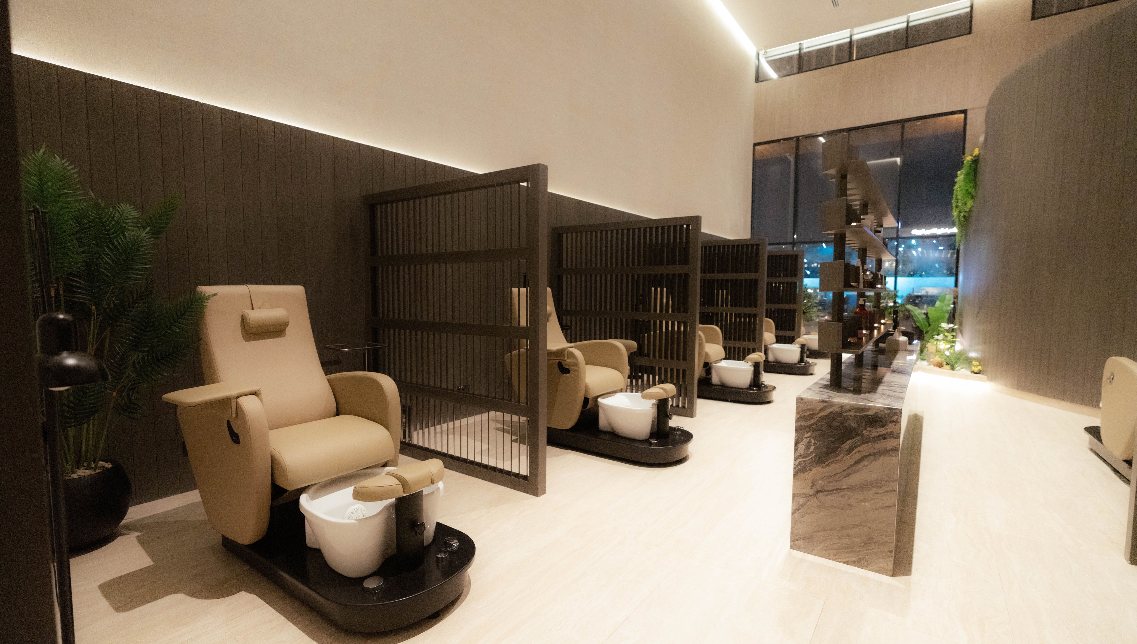 Relaxing pedicure lounge at Alpha Spa, Riyadh, Riyadh Province, SA, featuring plush chairs and serene ambiance.