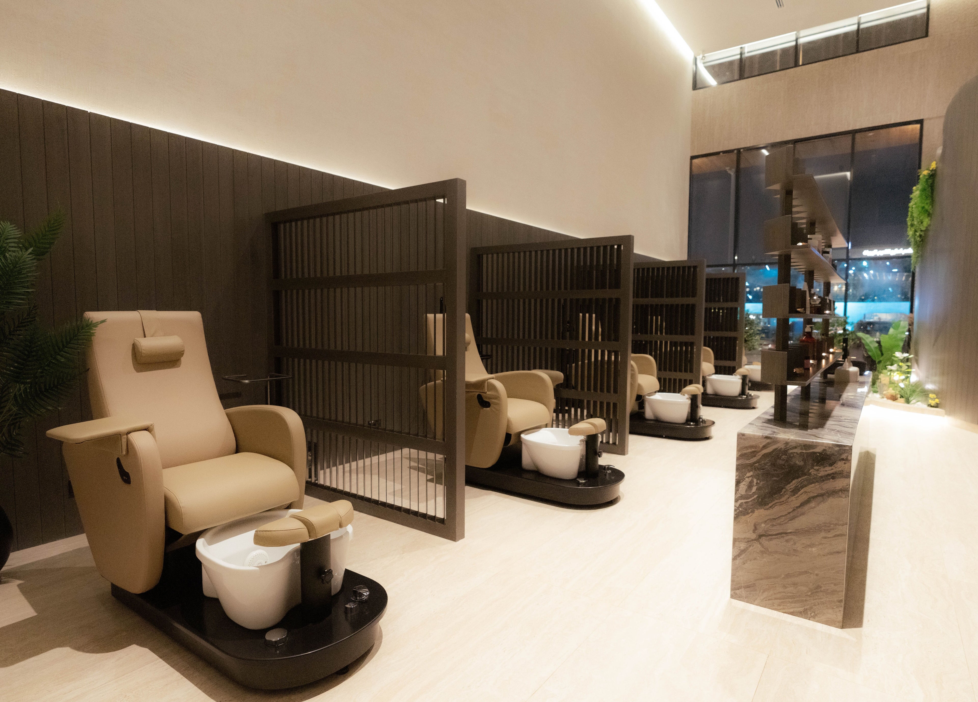 Relaxing pedicure lounge at Alpha Spa, Riyadh, Riyadh Province, SA, featuring plush chairs and serene ambiance.