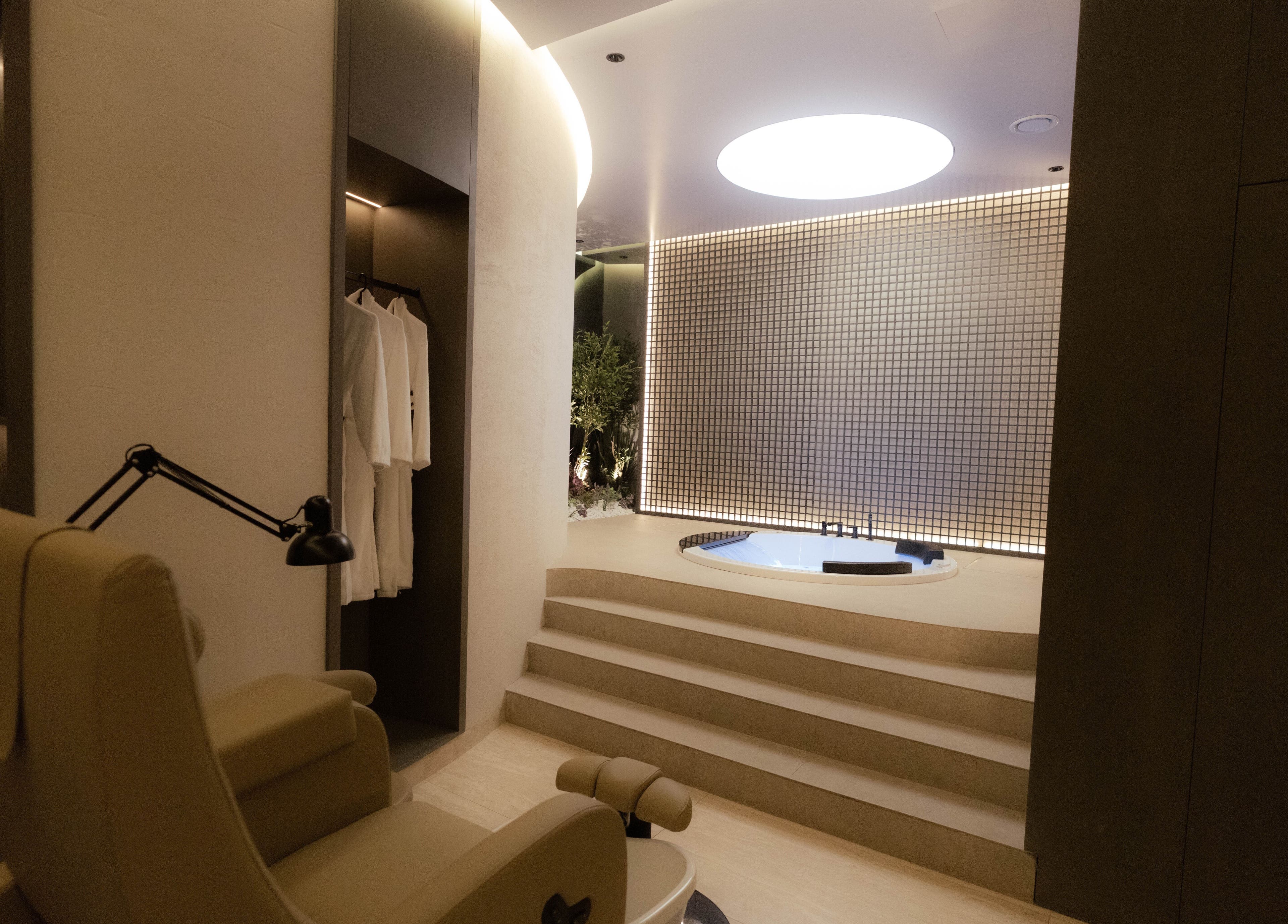 Luxurious spa room at Alpha Spa, Riyadh, featuring a cozy chair and elegant decor for ultimate relaxation.