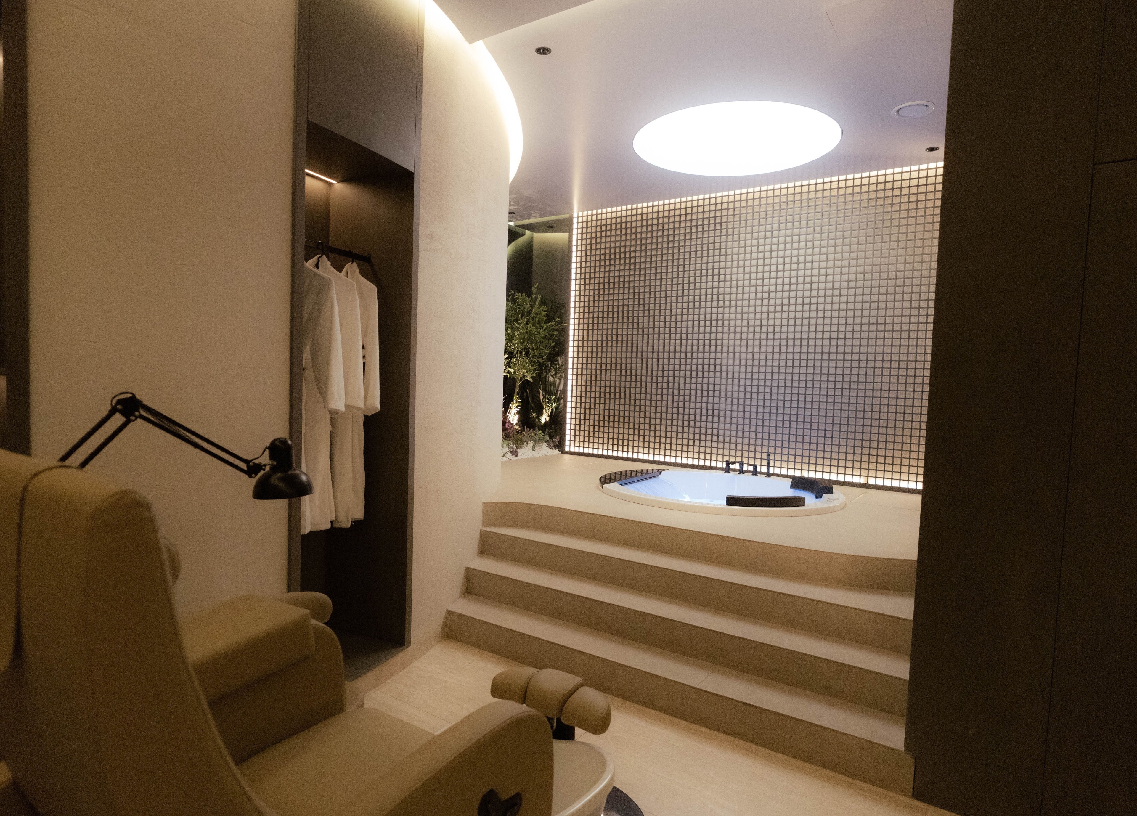 Luxurious spa room at Alpha Spa, Riyadh, featuring a cozy chair and elegant decor for ultimate relaxation.