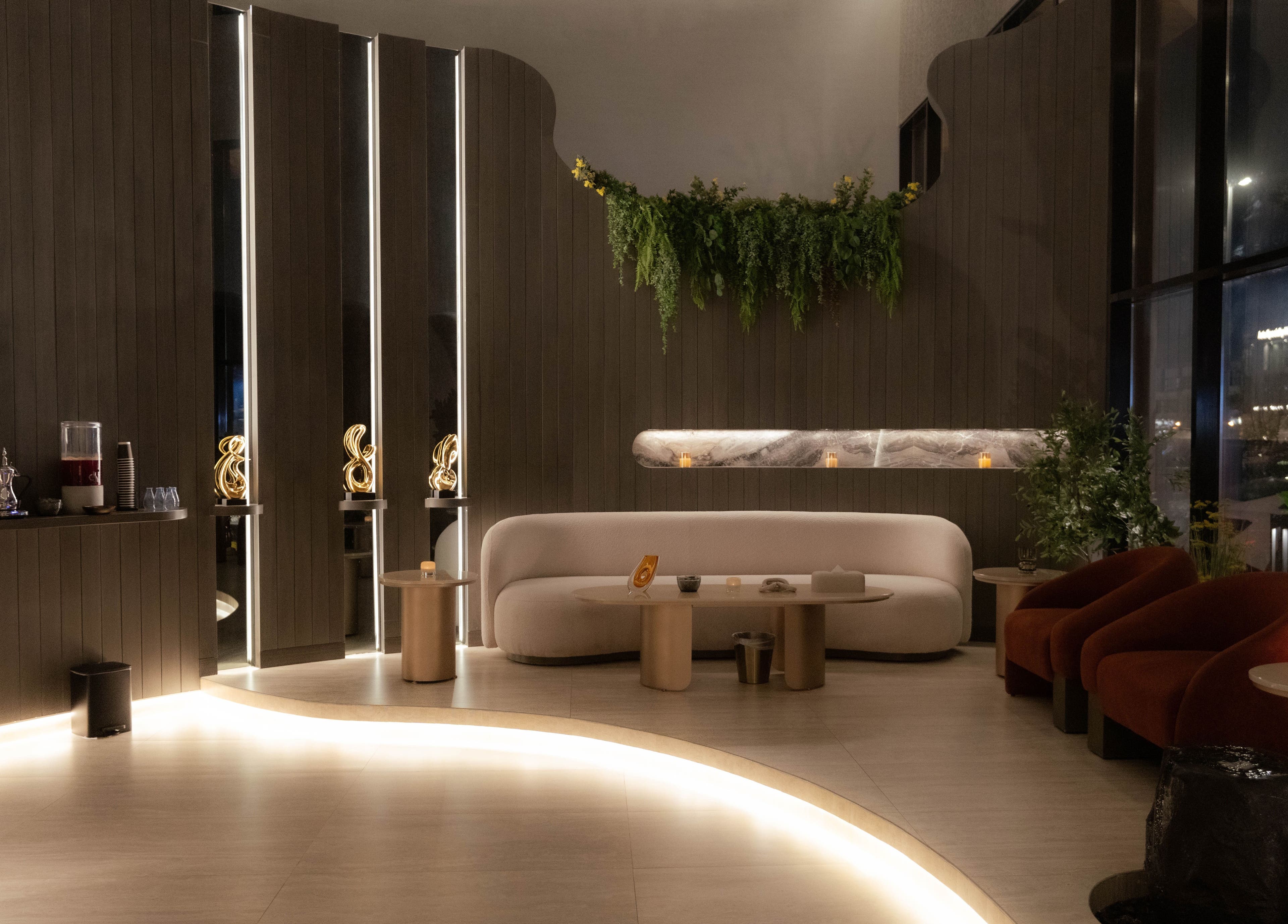 Luxurious seating area at Alpha Spa, Riyadh, Riyadh Province, SA showcasing elegant decor with warm lighting.