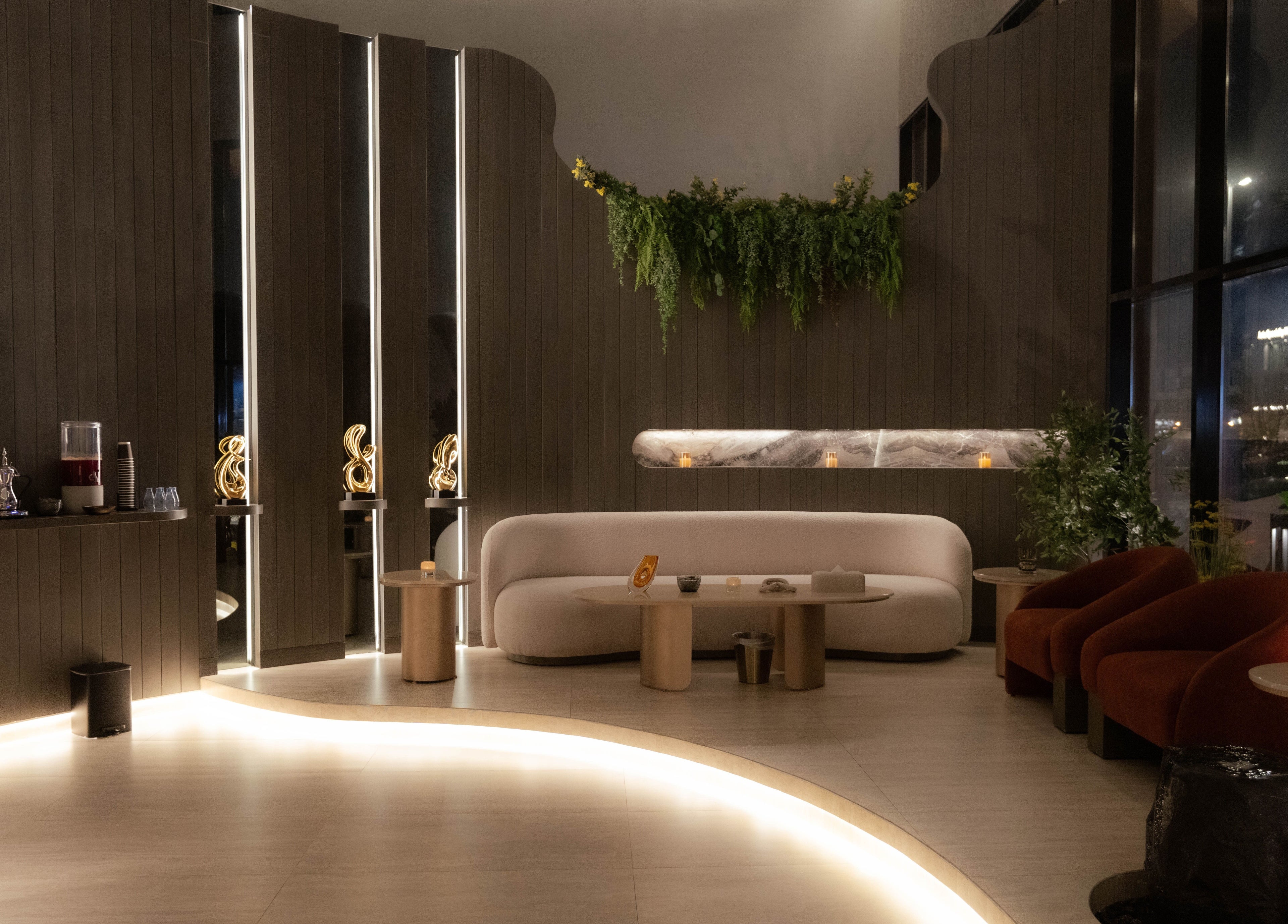 Luxurious seating area at Alpha Spa, Riyadh, Riyadh Province, SA showcasing elegant decor with warm lighting.