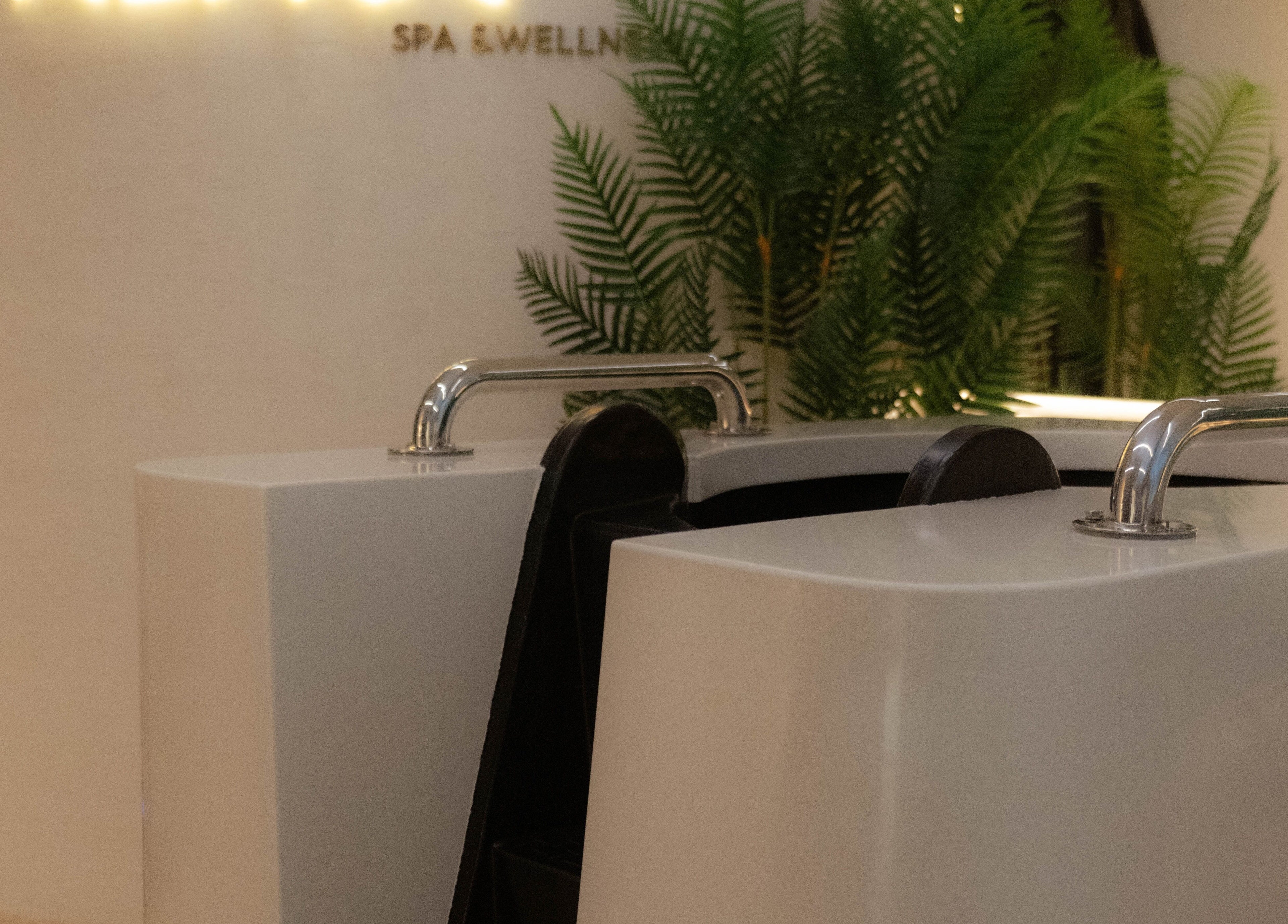 Luxurious spa tub at Alpha Spa, Riyadh, Riyadh Province, SA, surrounded by lush greenery.