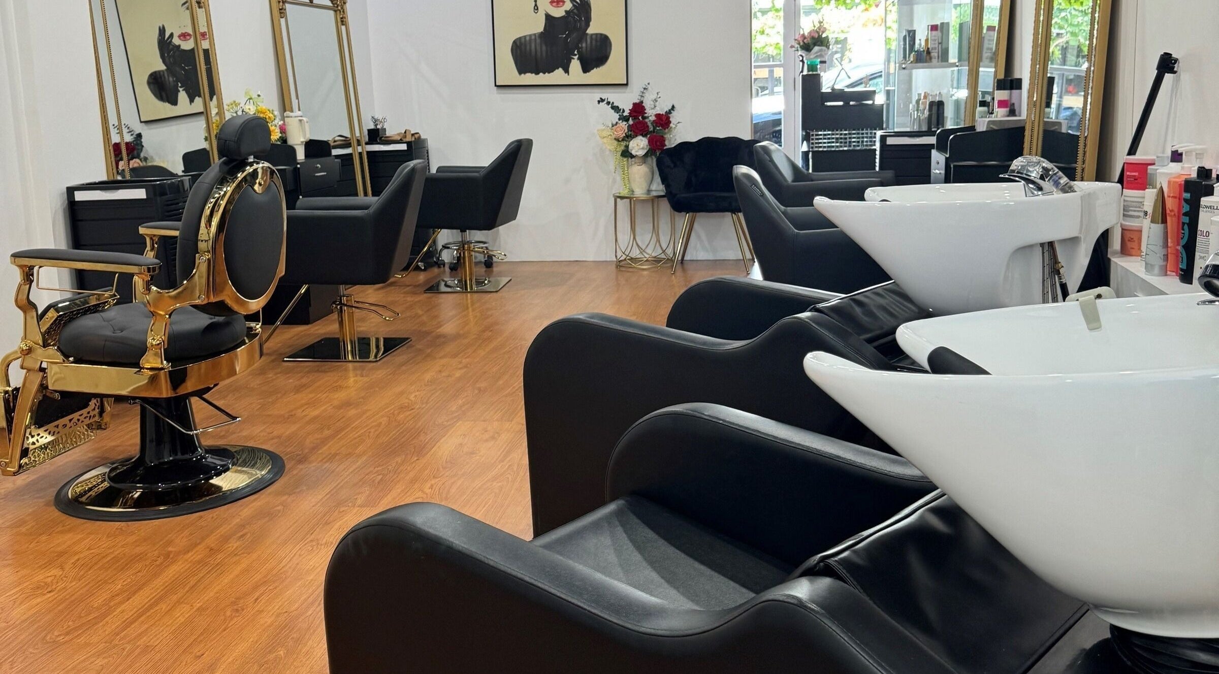 Elegant interior of Imperio Beauty Salon in Unley, South Australia, with stylish black and gold salon chairs.
