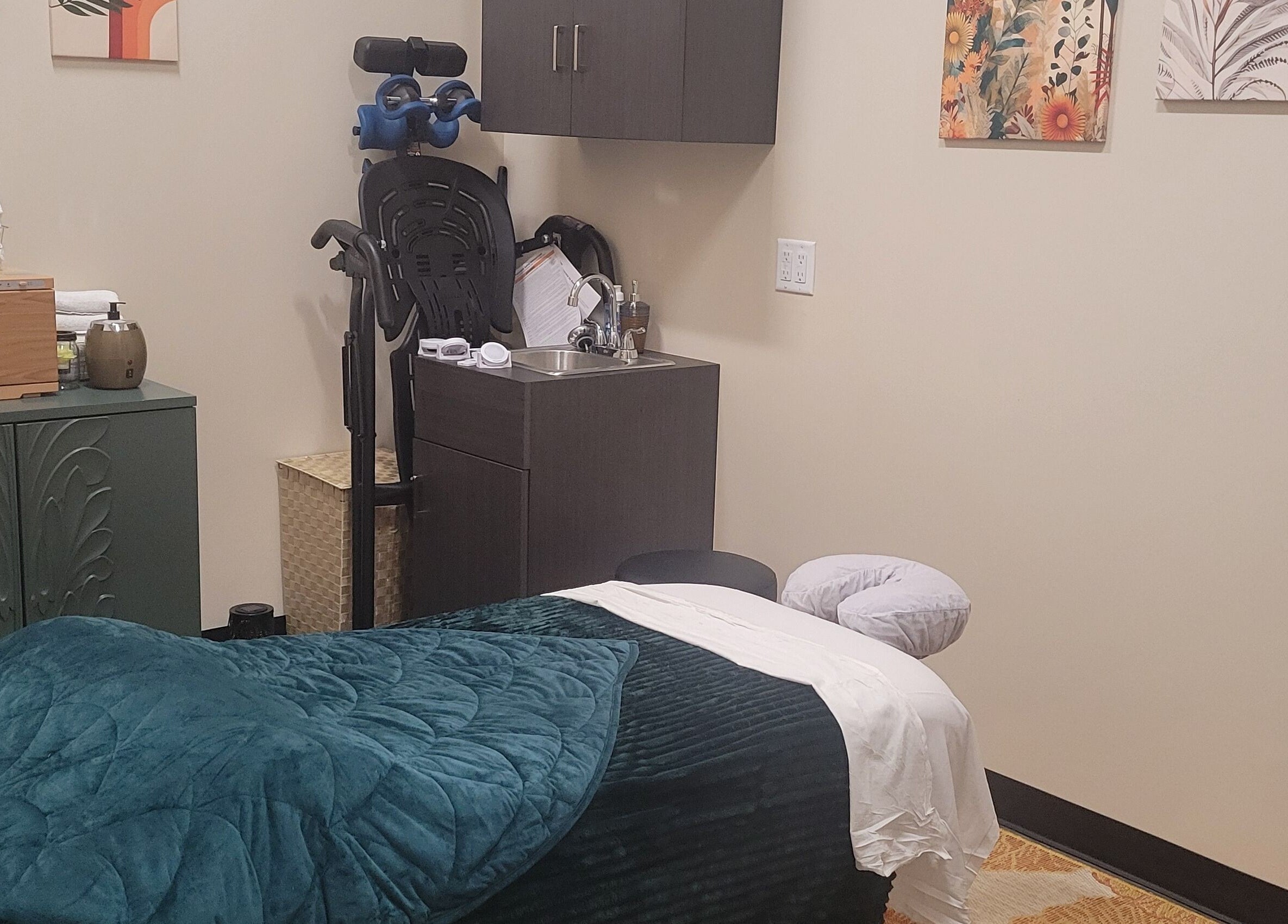 Cozy massage room at Taylored Spa and Massage in Bayonne, New Jersey, US, featuring a plush treatment table.