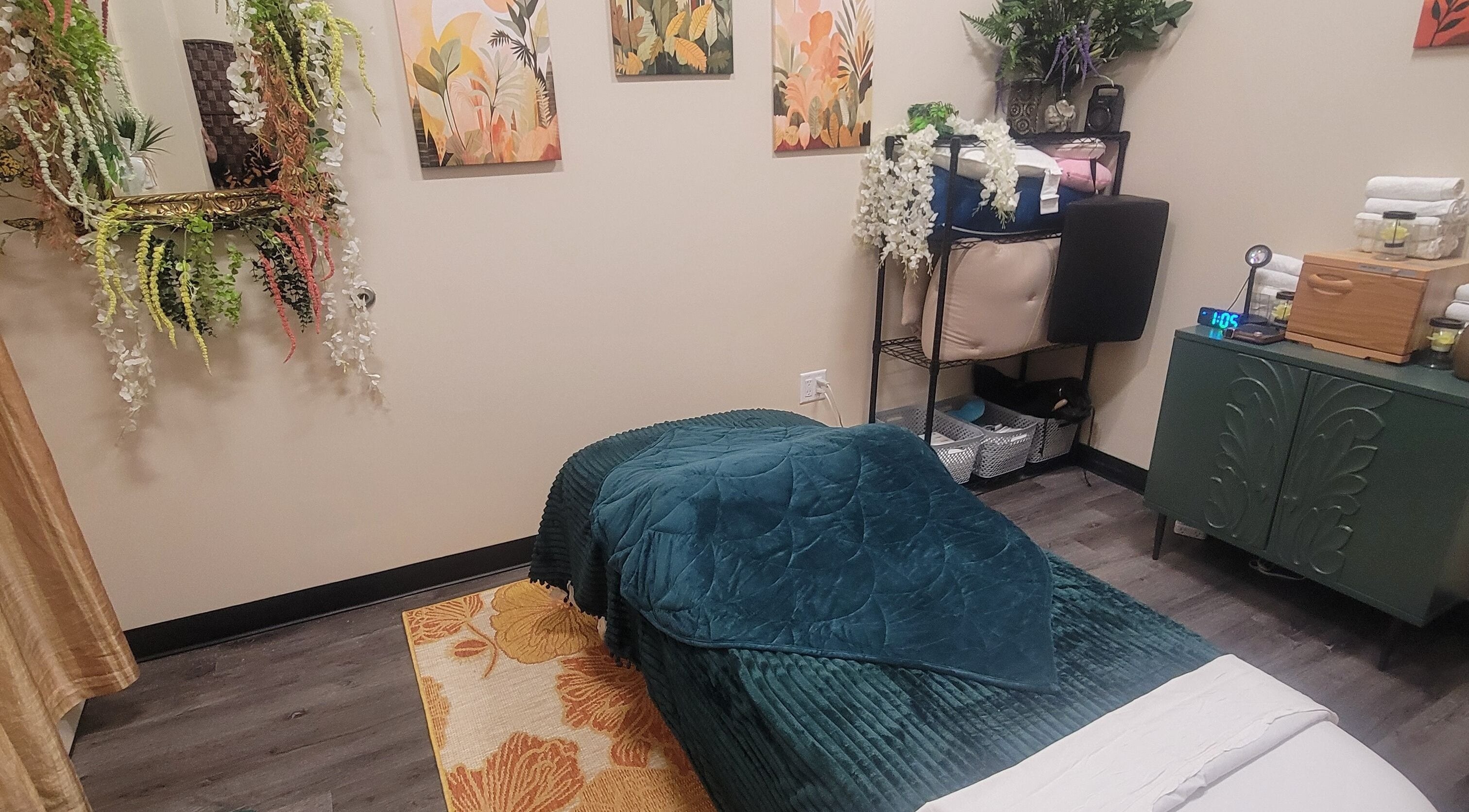 Cozy massage room at Taylored Spa and Massage, Bayonne, New Jersey, US, featuring relaxing decor and bed.