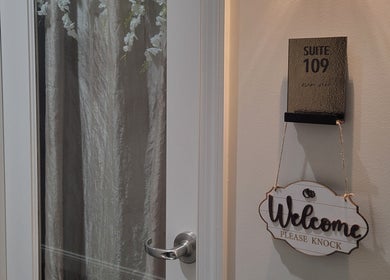 Entrance of Taylored Spa and Massage in Bayonne, New Jersey, US, with 'Welcome Please Knock' sign.