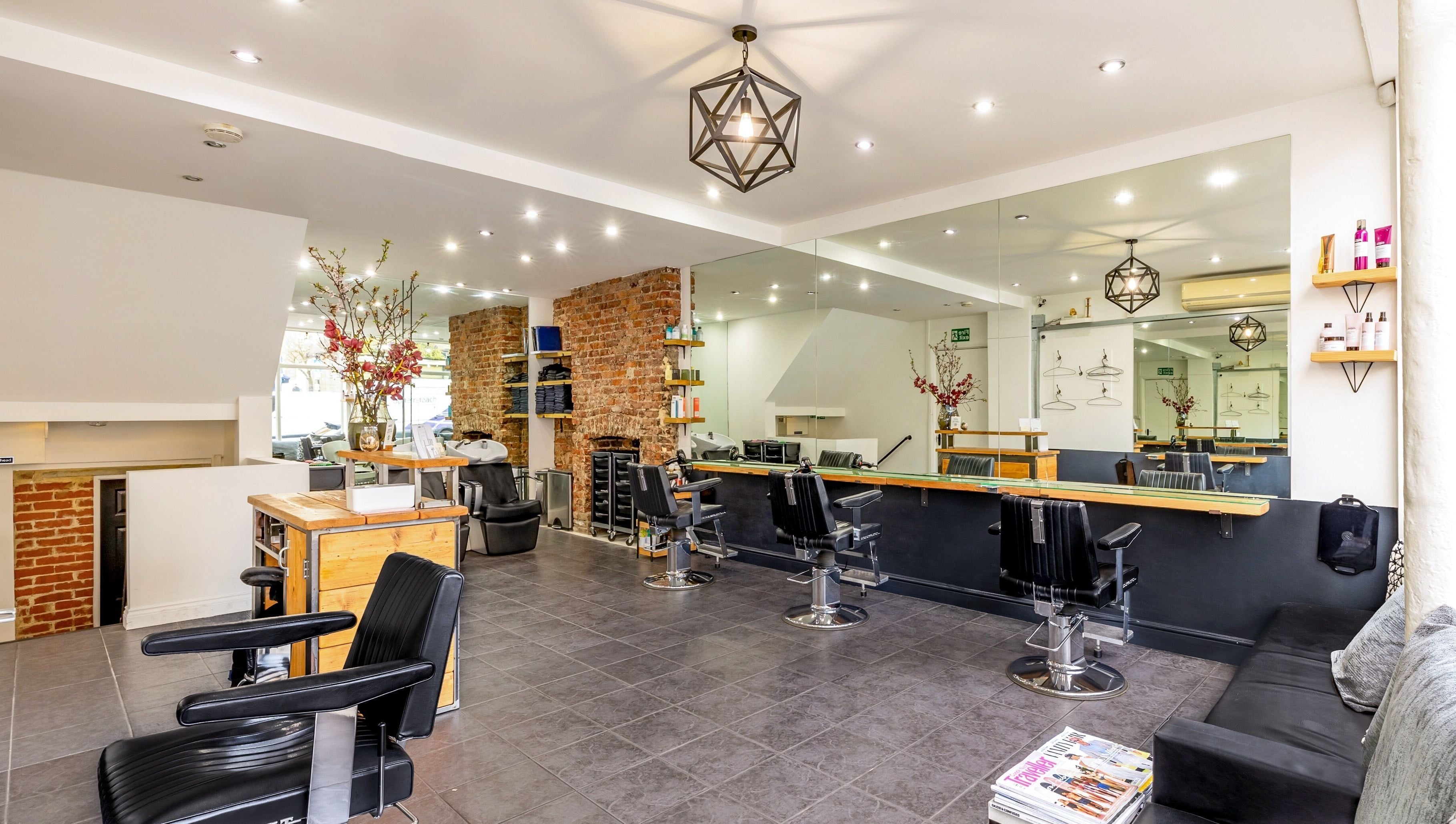 Stylish interior of Hikari Salon in London, England, GB, featuring modern decor and comfortable chairs.