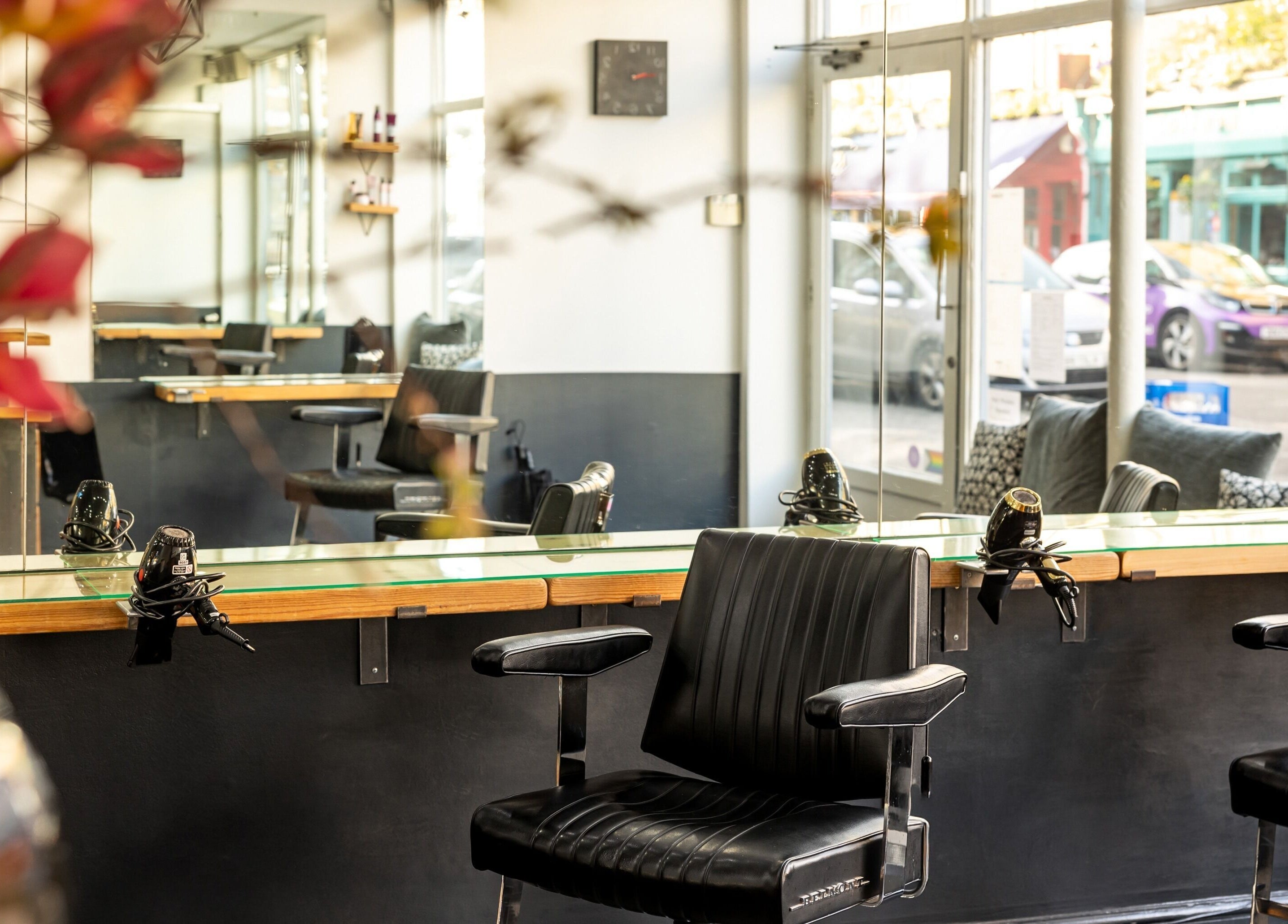Modern interior of Hikari Salon in London, England, GB featuring chic styling chairs and sleek decor.
