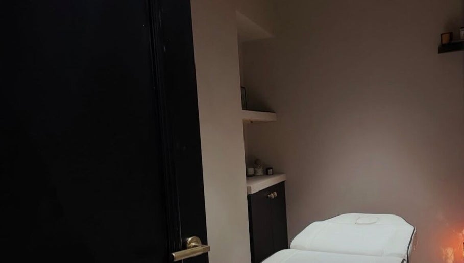 Cozy treatment room at Phace, Swinton, England, GB with a comfortable massage bed and ambient lighting.