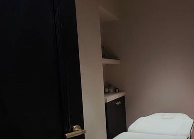 Cozy treatment room at Phace, Swinton, England, GB with a comfortable massage bed and ambient lighting.