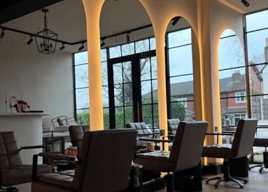 Sophisticated interior of Phace in Swinton, England, GB featuring elegant seating and arched windows.