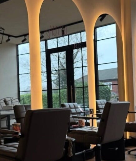 Sophisticated interior of Phace in Swinton, England, GB featuring elegant seating and arched windows.