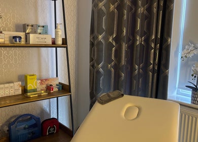 Relaxing treatment room at Becketts Aesthetics, Southport, England, GB with modern decor and wellness products.