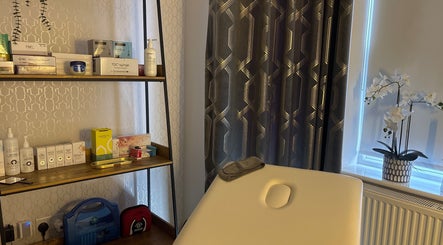 Relaxing treatment room at Becketts Aesthetics, Southport, England, GB with modern decor and wellness products.