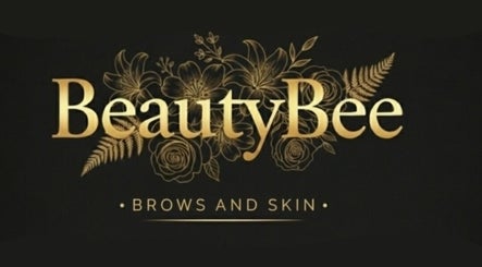 Elegant Beauty Bee logo with floral design in gold, Dover, England, GB.