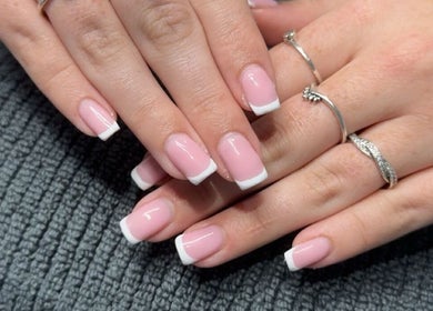 Elegant French manicure at Luxe Lush, Holywell, Flintshire, GB, showcasing refined nail art.