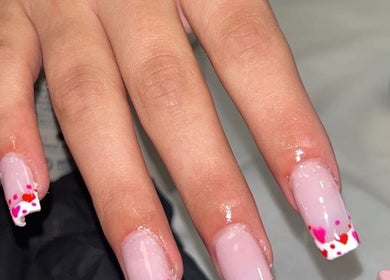 Elegant pink nails with heart tips at Luxe Lush, Holywell, Flintshire, GB.