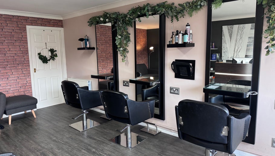 Modern salon chairs and mirrors at Hair by Emma at Xclusive in Bournemouth, England, GB.