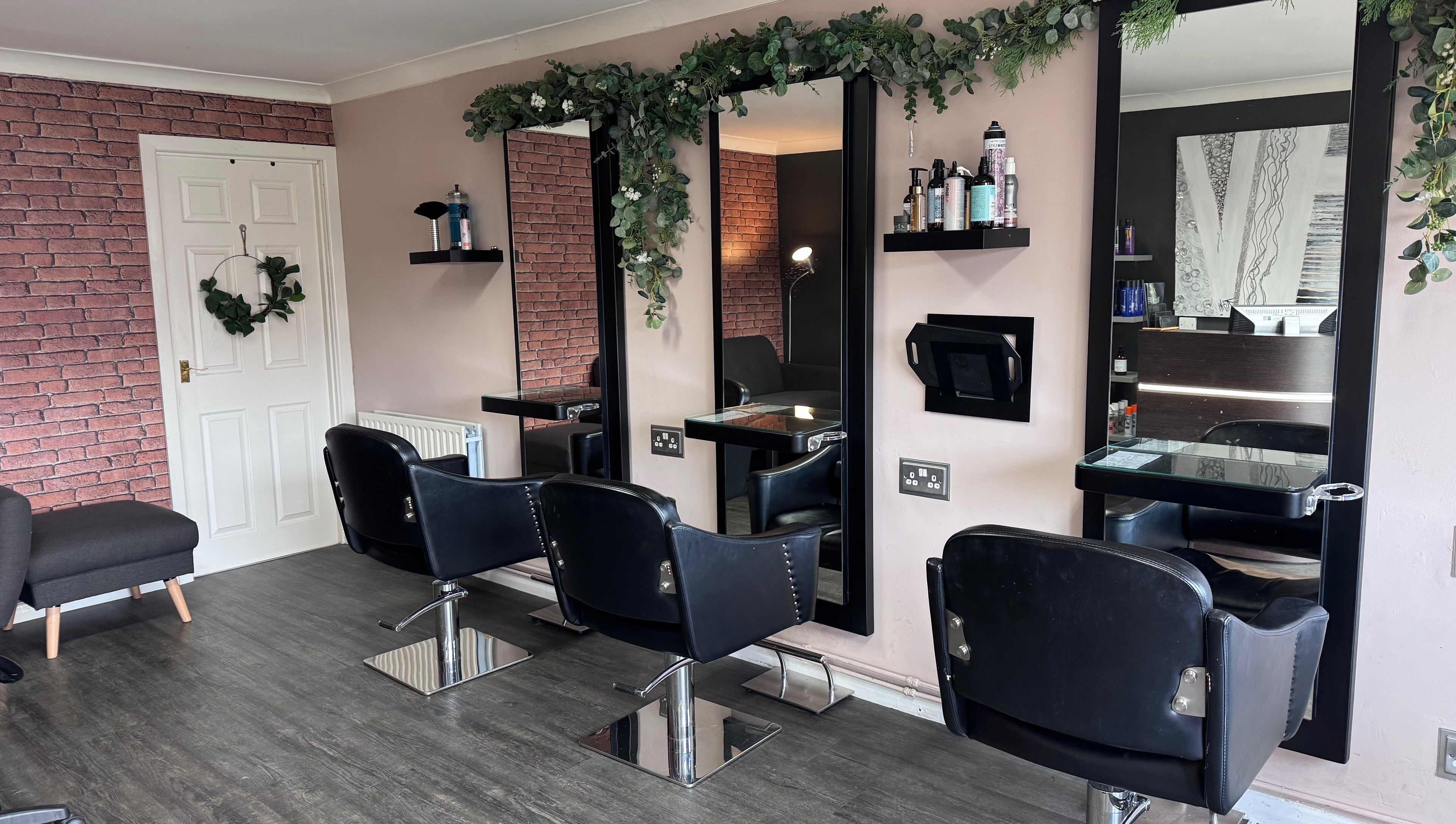 Modern salon chairs and mirrors at Hair by Emma at Xclusive in Bournemouth, England, GB.