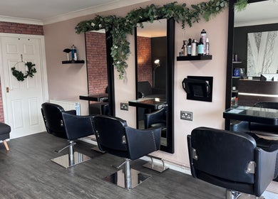 Modern salon chairs and mirrors at Hair by Emma at Xclusive in Bournemouth, England, GB.