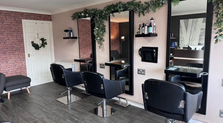 Modern salon chairs and mirrors at Hair by Emma at Xclusive in Bournemouth, England, GB.