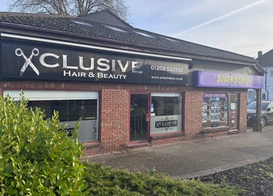 Exterior of Hair by Emma at Xclusive, Bournemouth, England, GB, showcasing a stylish salon entrance.