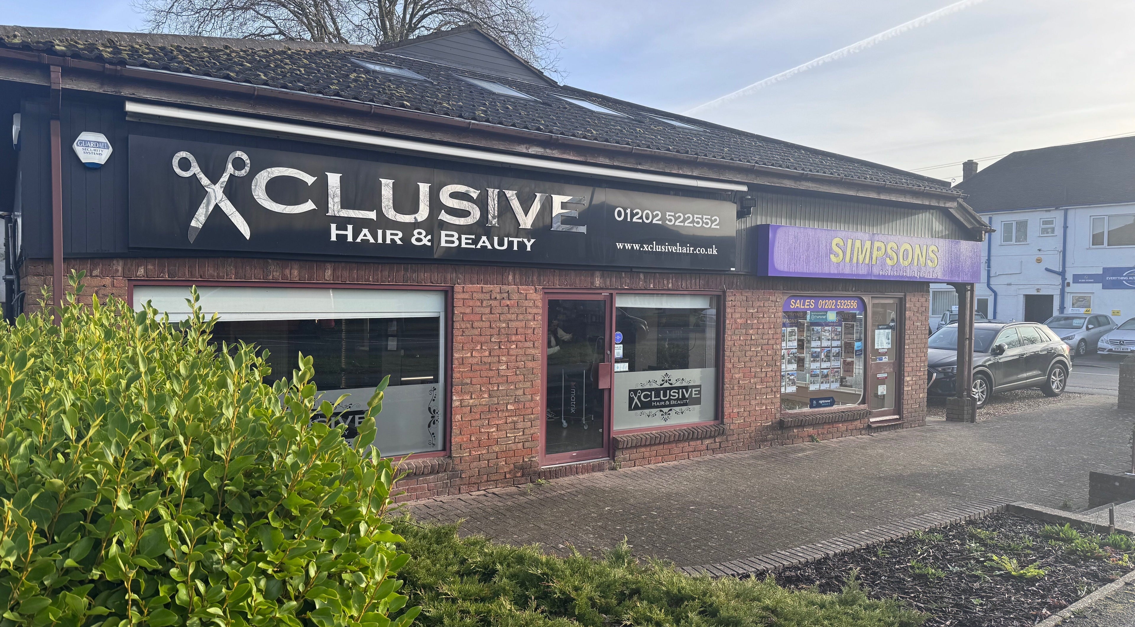 Exterior of Hair by Emma at Xclusive, Bournemouth, England, GB, showcasing a stylish salon entrance.