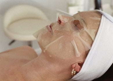 Facial mask treatment at Kati Aesthetics, London, England, GB, enhancing skin radiance and relaxation.