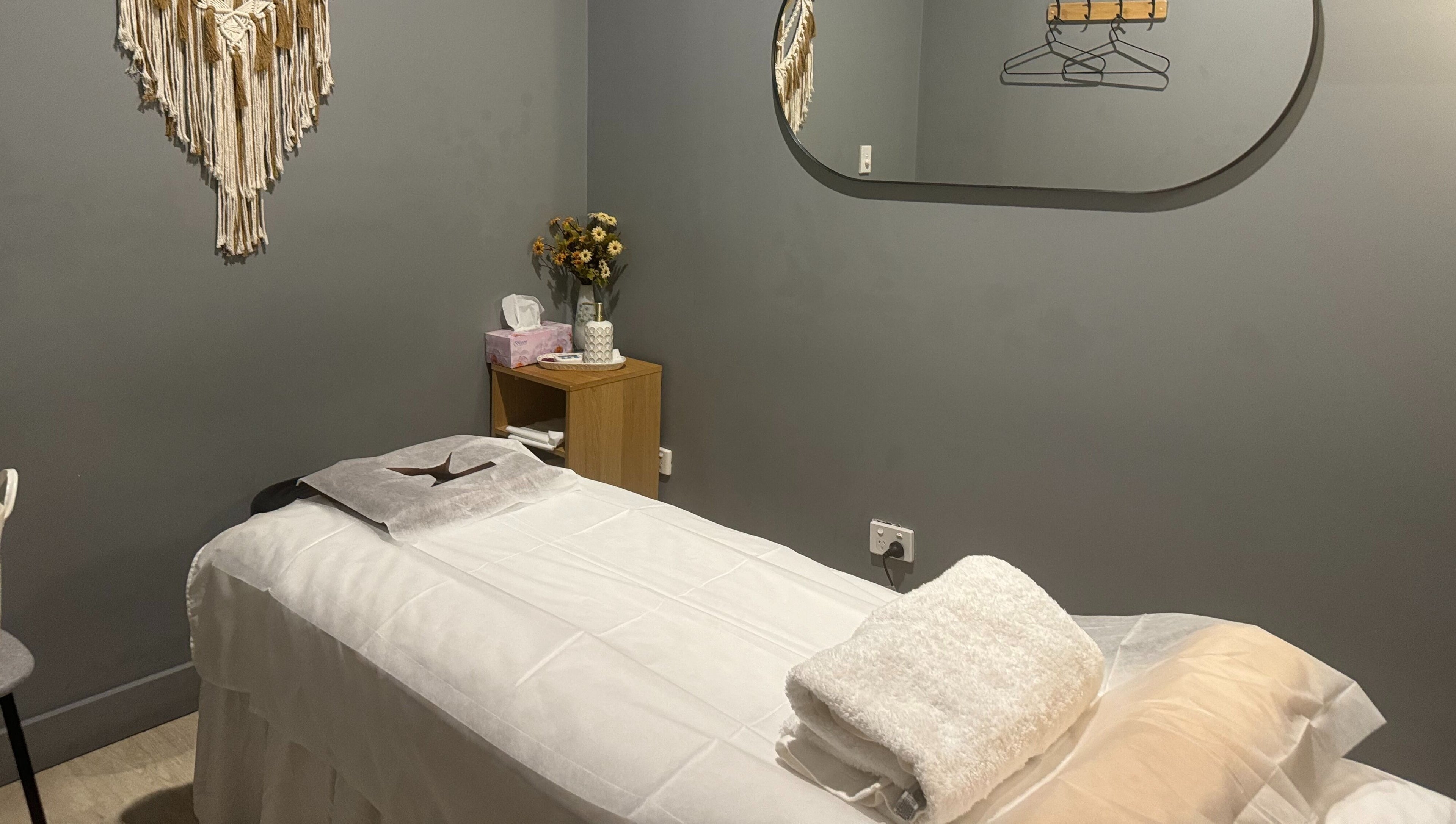 Relaxing massage room at Zen Massage & Reflexology, Chatswood, New South Wales, AU, with a serene setup.