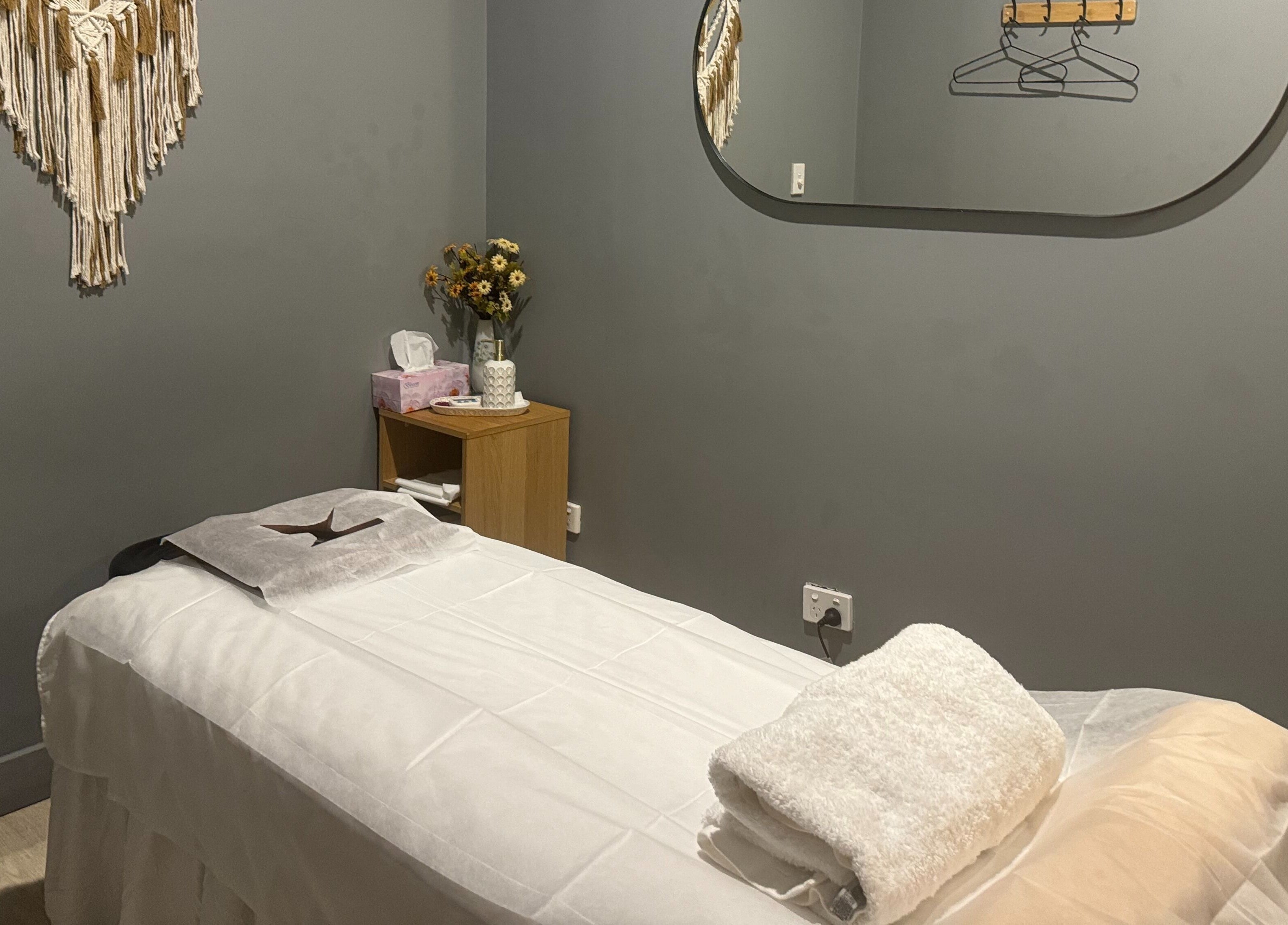 Relaxing massage room at Zen Massage & Reflexology, Chatswood, New South Wales, AU, with a serene setup.