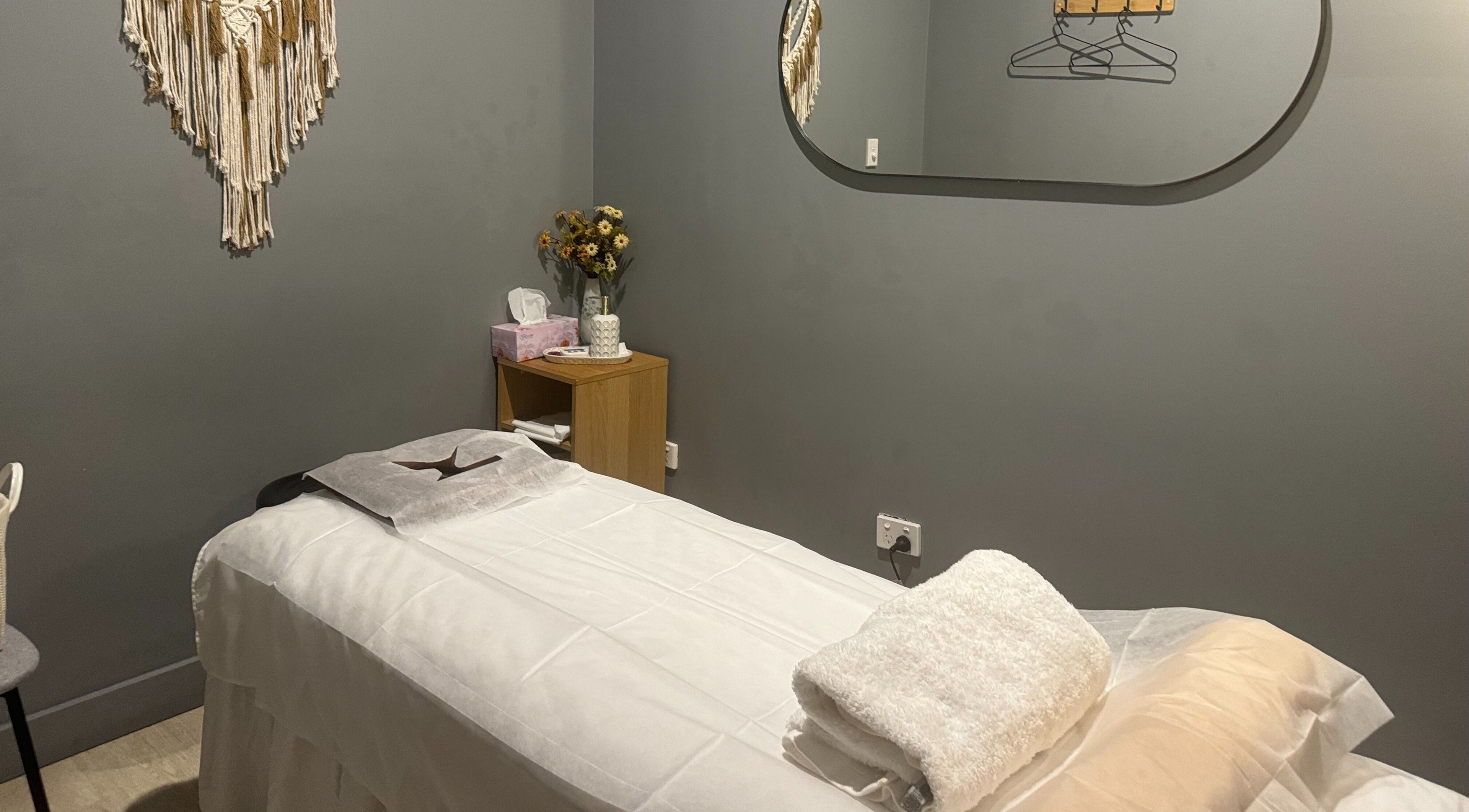 Relaxing massage room at Zen Massage & Reflexology, Chatswood, New South Wales, AU, with a serene setup.