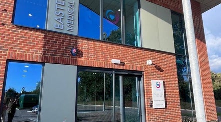 Entrance of Eastergate Medical Aesthetics in Eastergate, England, showcasing a modern brick facade.