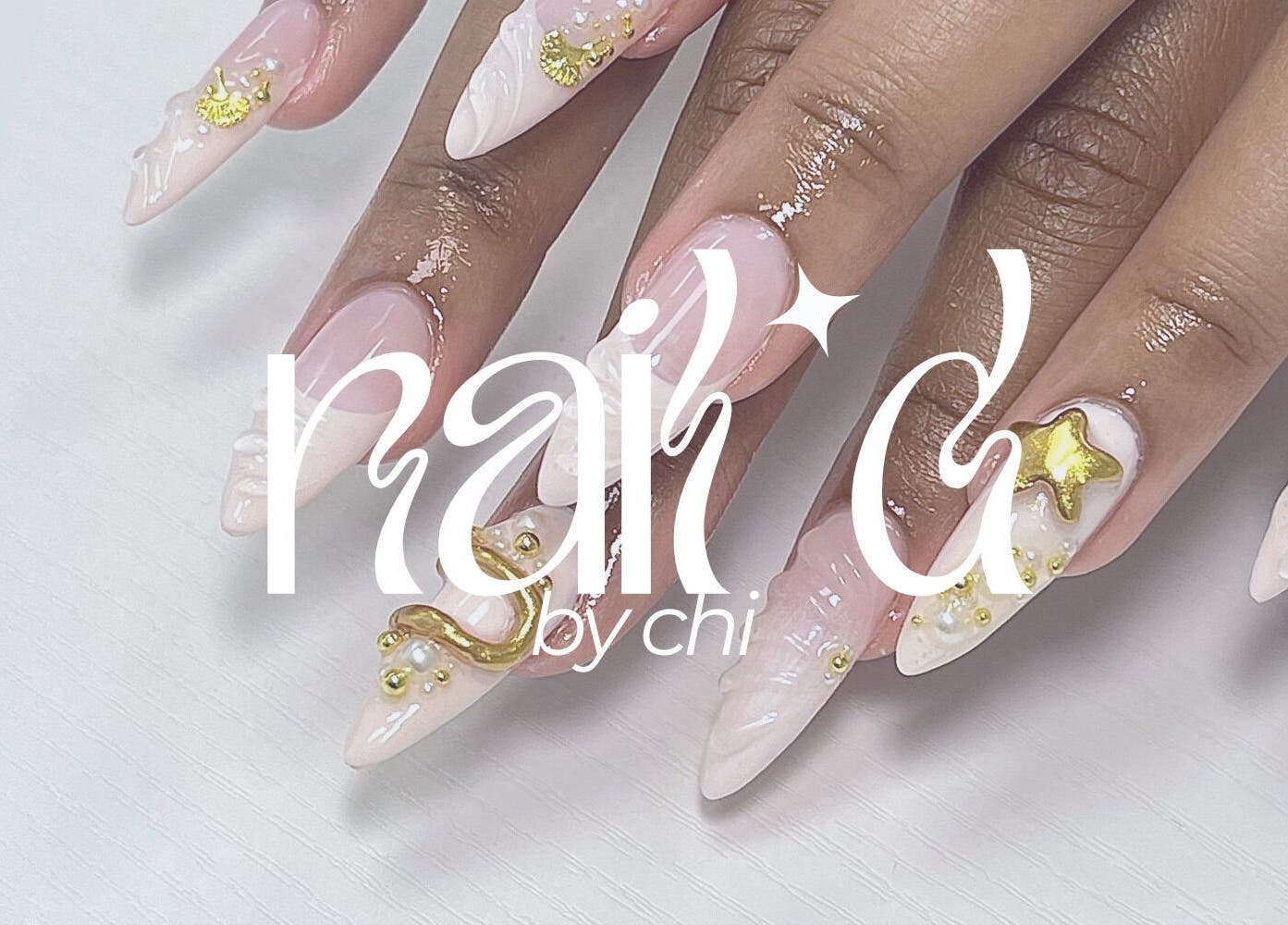 Stylish manicured nails at NAIL'D BY CHI, Pickering, Ontario, CA, featuring exquisite gold embellishments.
