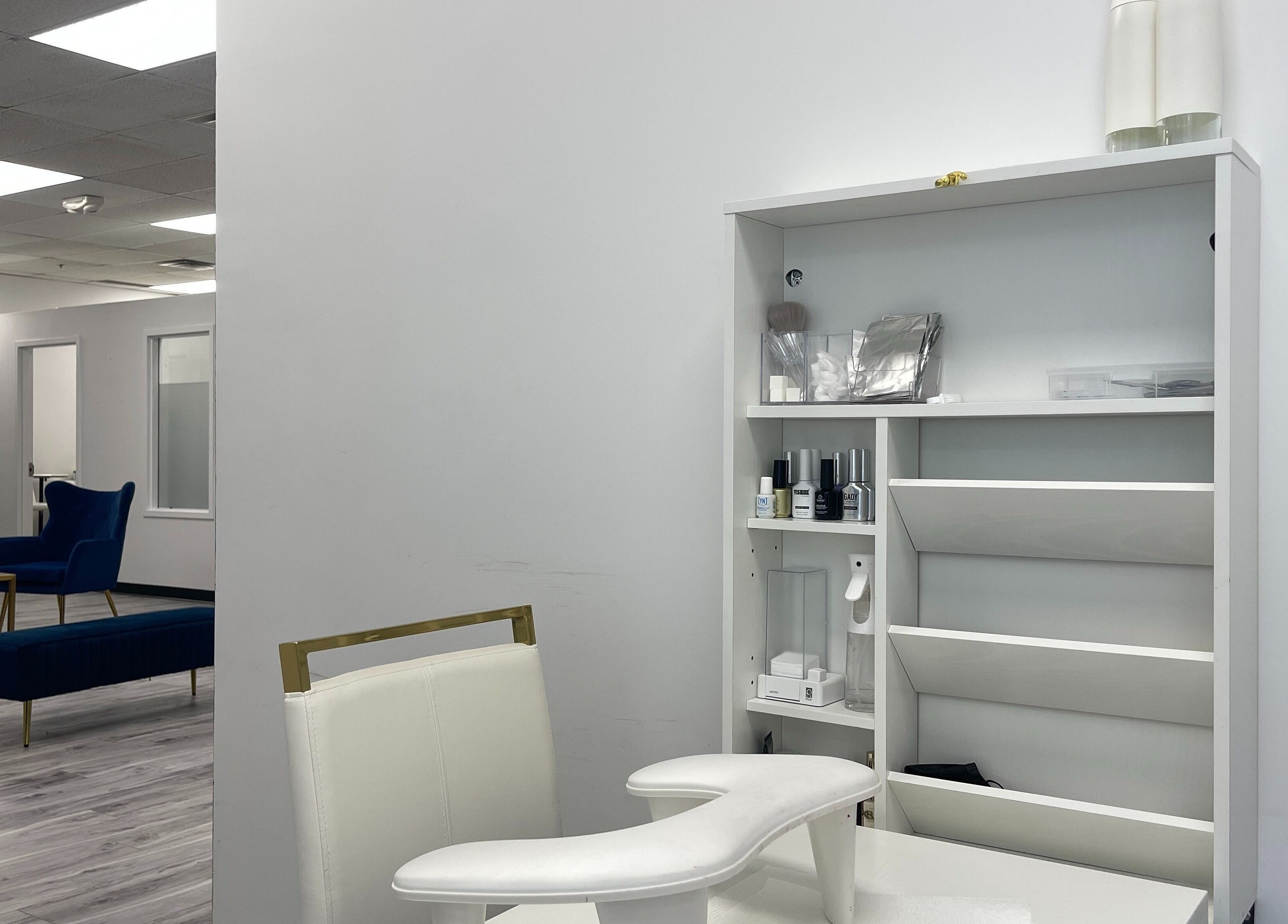 Elegant nail care station at NAIL'D BY CHI, Pickering, Ontario, CA with plush seating and chic design.