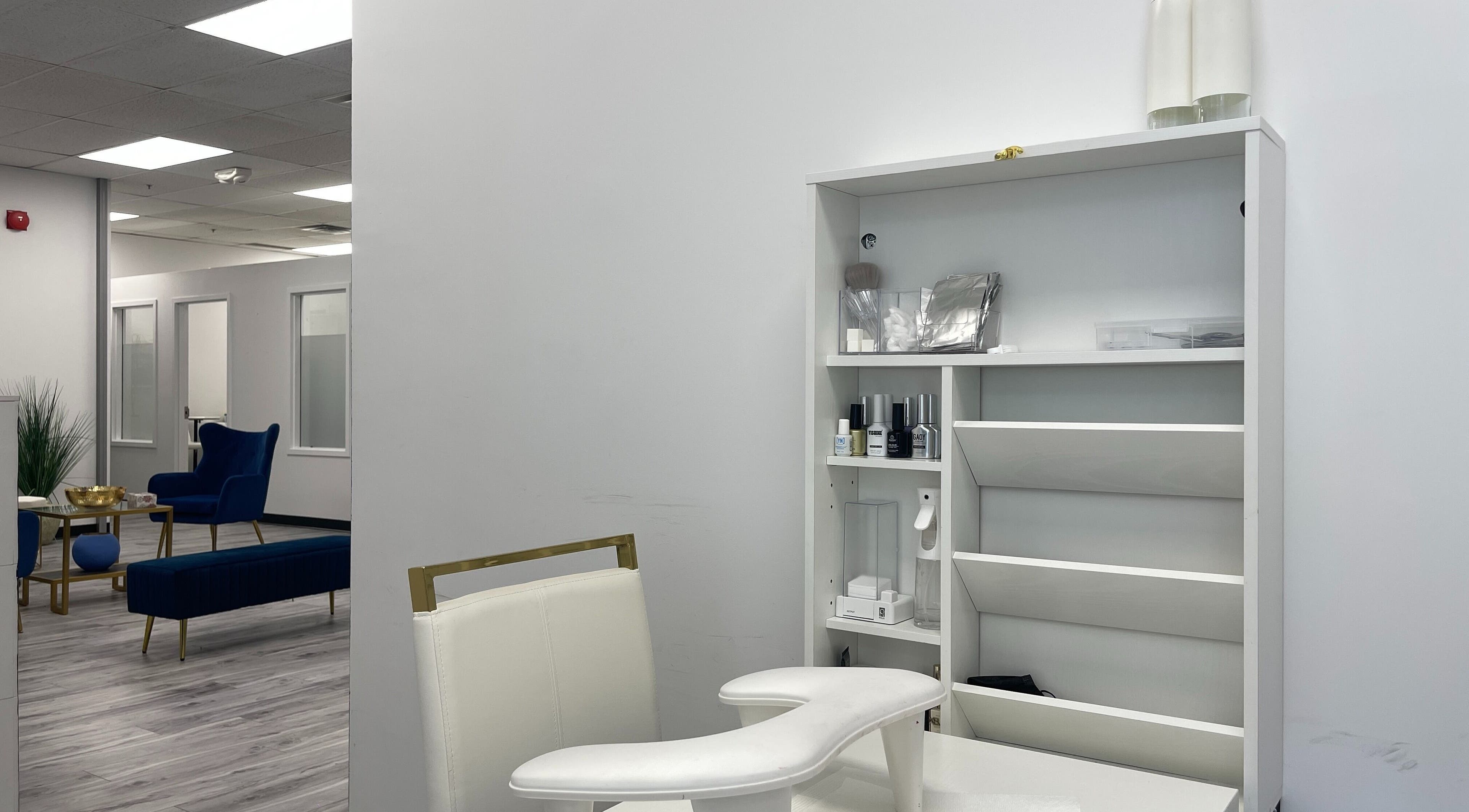 Elegant nail care station at NAIL'D BY CHI, Pickering, Ontario, CA with plush seating and chic design.