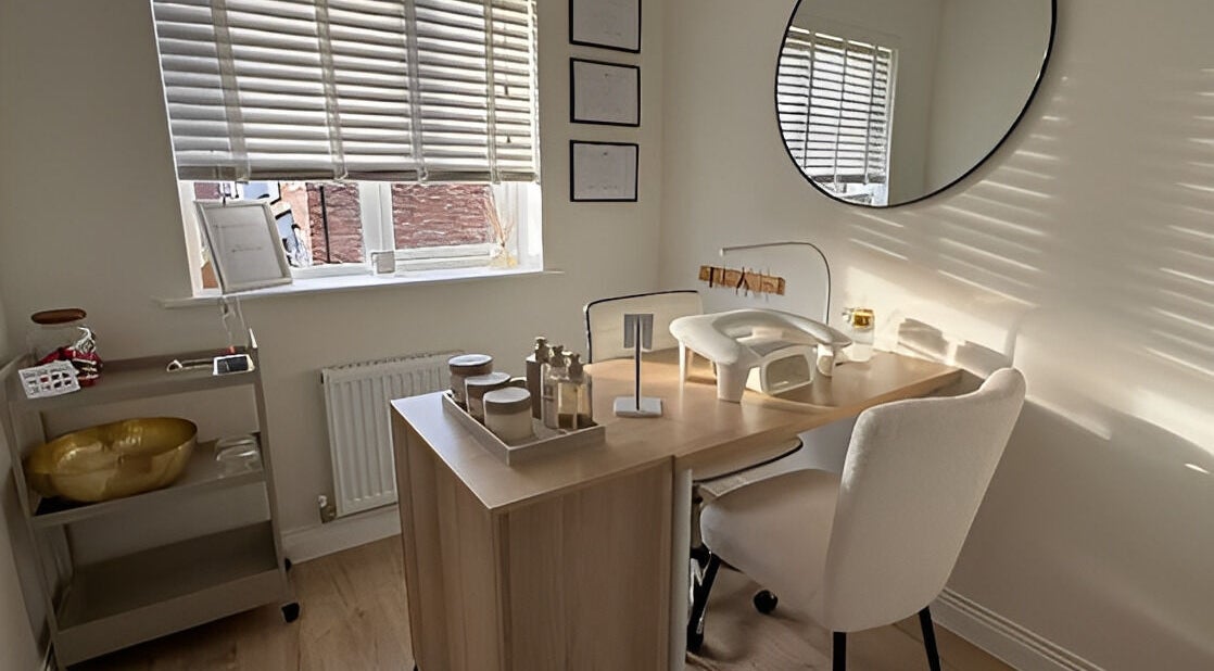 Bright nail care station at So-Swifticated Beauty By Anna, Farington, England, GB. Cozy wood desk and natural light.