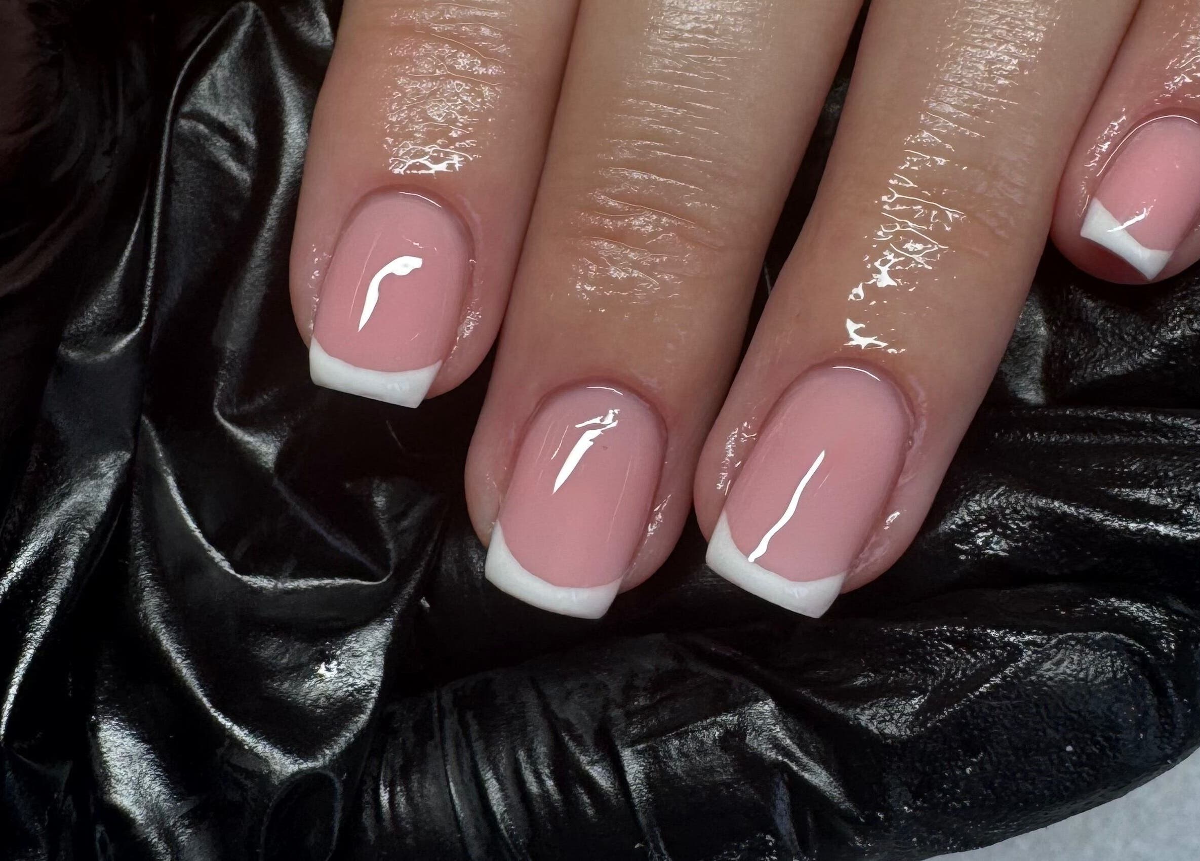 Elegant French manicure at So-Swifticated Beauty By Anna, Farington, England, GB. Stunning pink and white design.