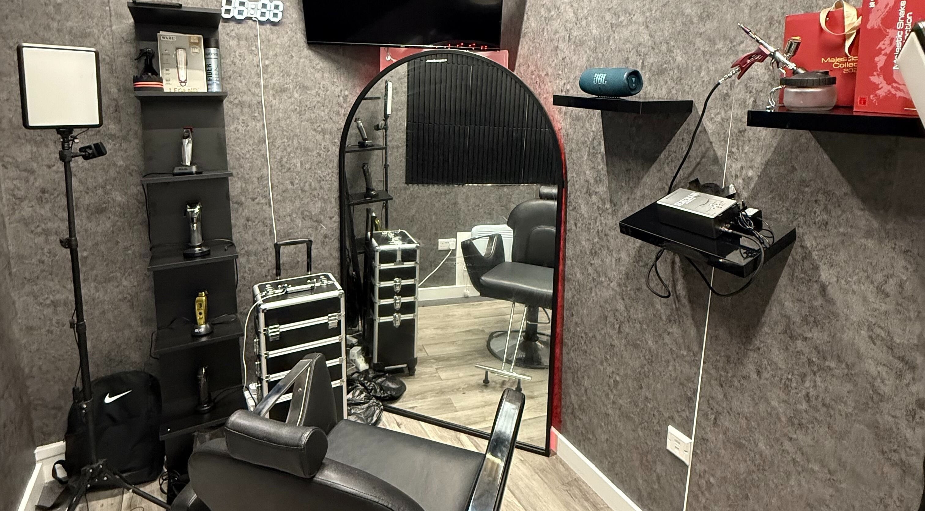 Interior of CKAY SGL Barbershop in London, England, GB featuring stylish barber chair and grooming tools.