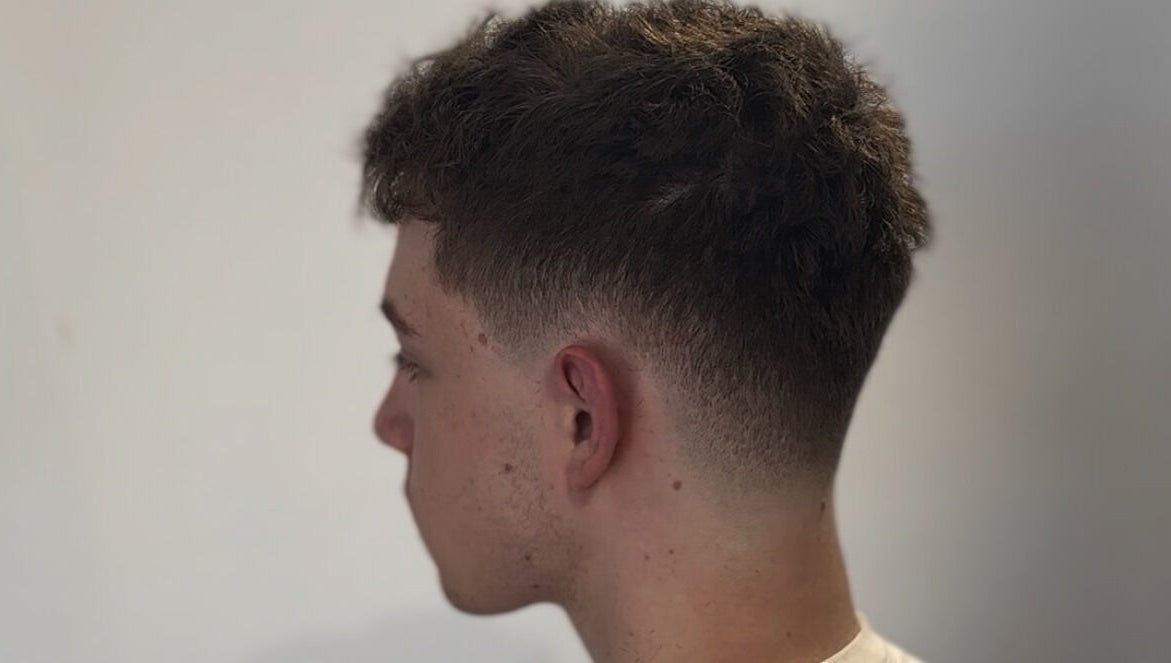 Stylish fade haircut for men at HairbyLiam, Lara, Victoria, AU showcasing modern grooming.