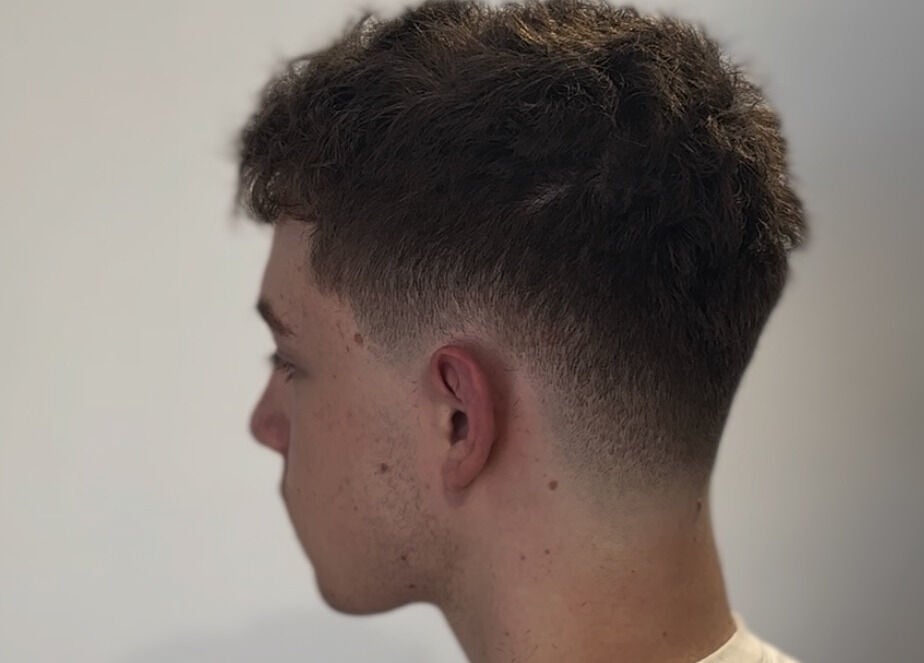 Stylish fade haircut for men at HairbyLiam, Lara, Victoria, AU showcasing modern grooming.