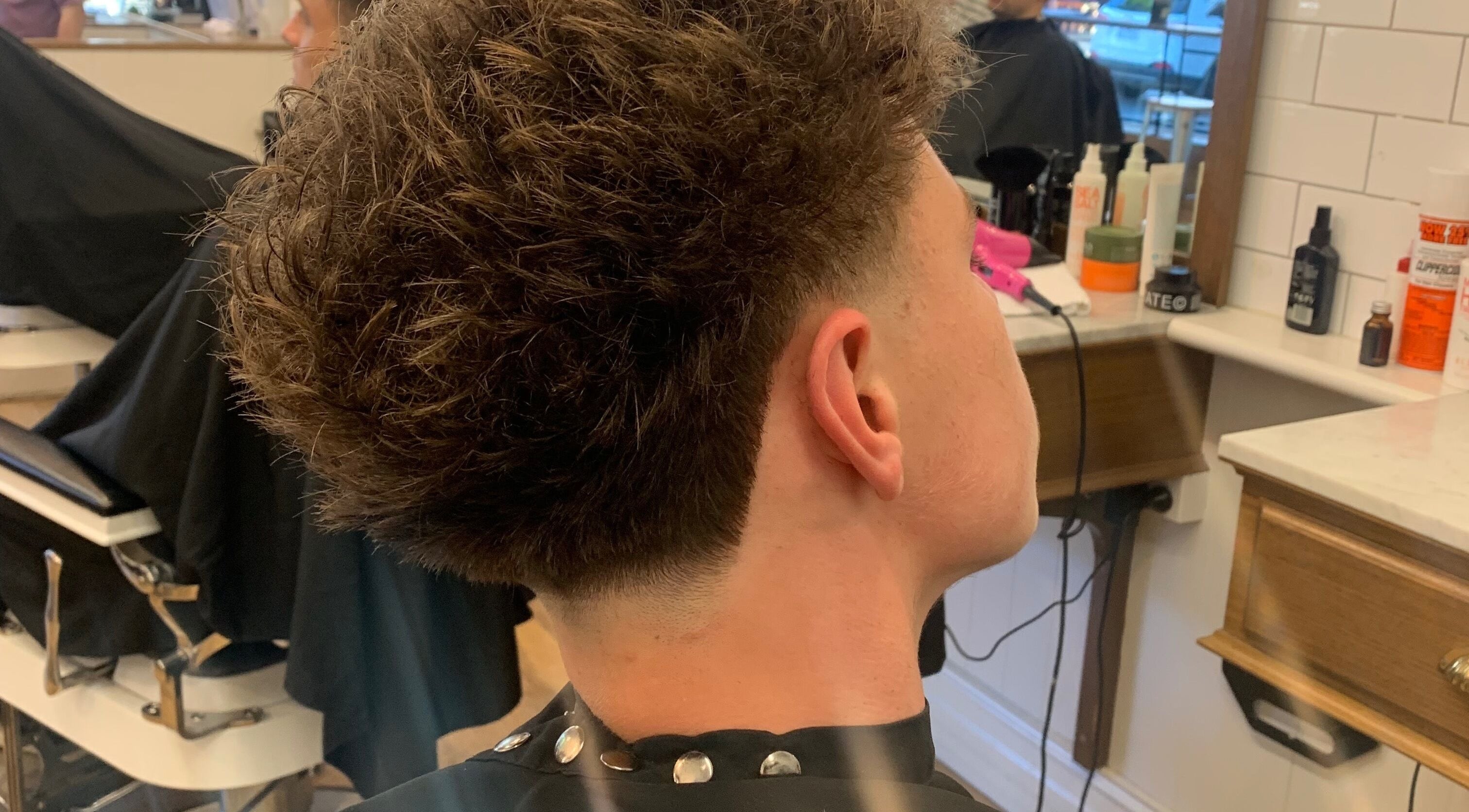 Close-up of a stylish men's haircut at HairbyLiam, Lara, Victoria, AU showcasing expert barber skills.